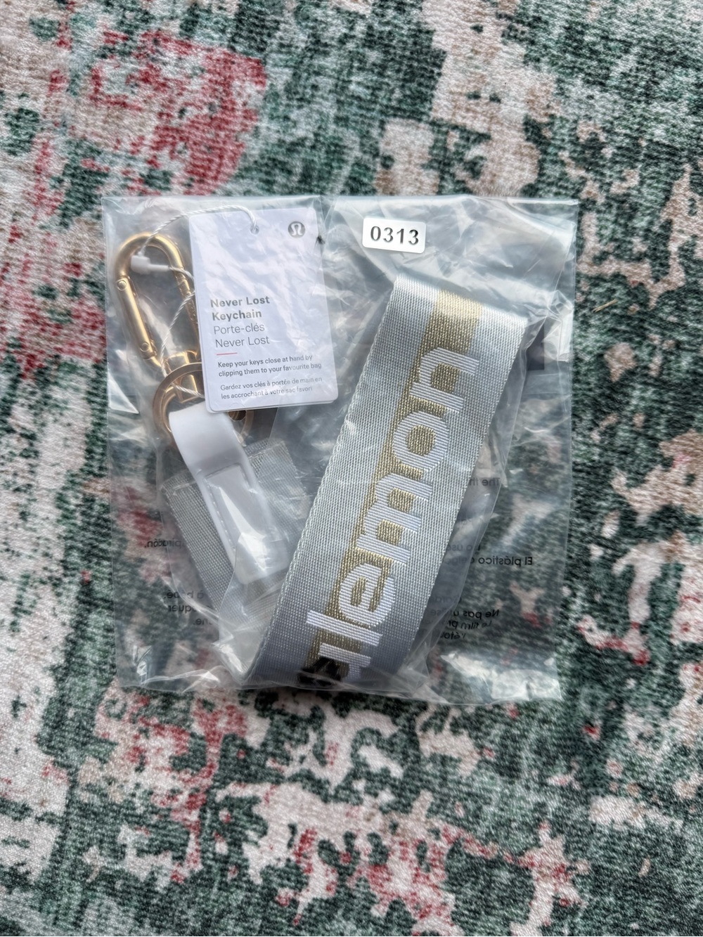 lululemon athletica Never Lost Keychain Lanyard in light grey with Gold Logo